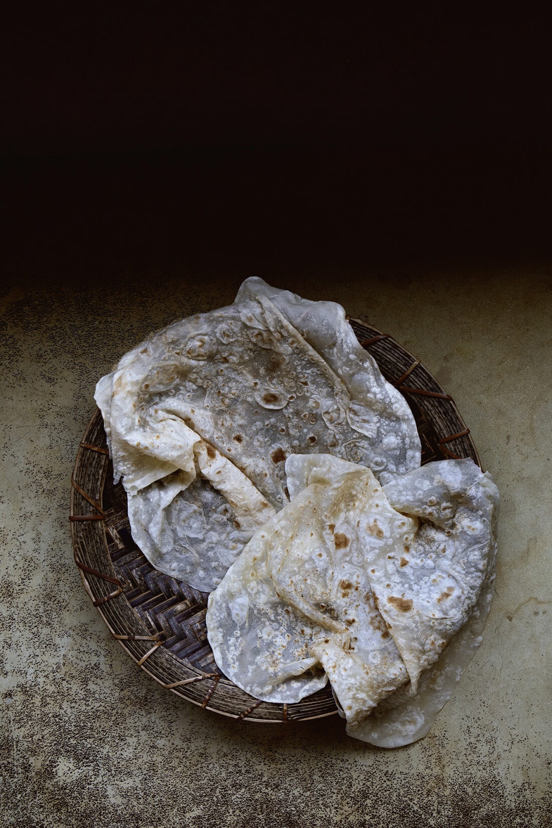 Paper thin soft chewy, Sonoranstyle flour tortilla Lady and Pups